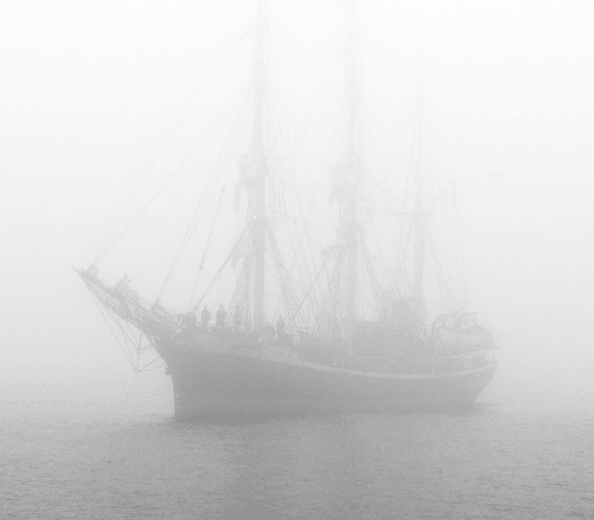 Rusty oil tanker at twilight